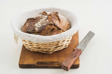 Rustic sourdough bread and knifeの写真素材