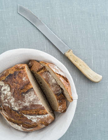 Rustic sourdough bread and knifeの写真素材