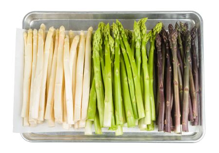 Bunch of fresh white asparagus on baking tray isolated on whiteの写真素材