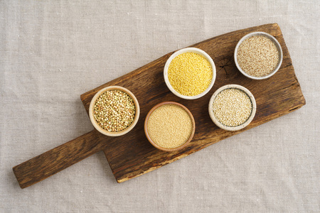 Collection of gluten free grain in small bowls.の写真素材