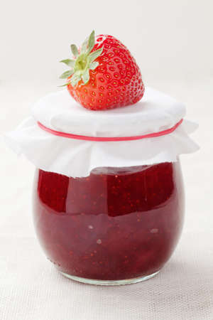Home made strawberry jam with a fresh strawberryの写真素材