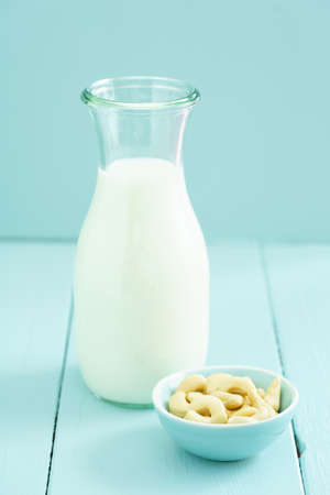 Fresh homemade cashew milk in a bottle with fresh cashewsの写真素材