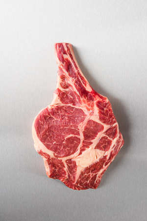 Dry aged Rib eye steak on stainless steel