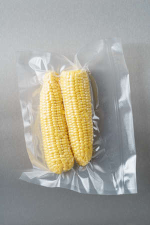 Vacuum sealed fresh corncobs for sous vide cookingの写真素材