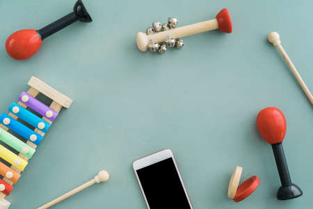 Collection of musical instruments with copyspace on turquoise