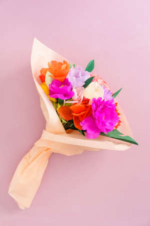 Bouquet of handmade paper flowers in tissue paperの写真素材
