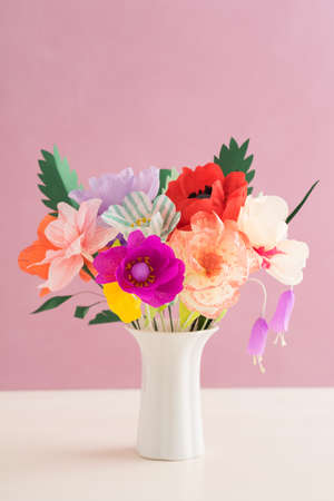 Bouquet of handmade paper flowers in a vaseの写真素材