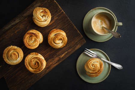 Fresh baked cruffins trend pastry in baking tin from aboveの写真素材