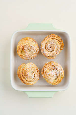 Fresh baked cruffins trend pastry in light bowlの写真素材