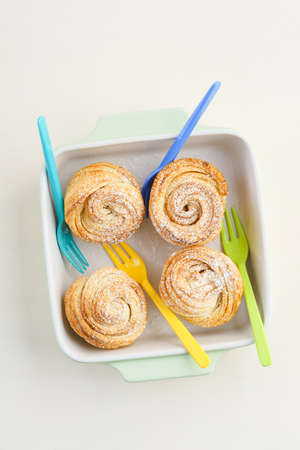 Fresh baked cruffins trend pastry in light bowlの写真素材