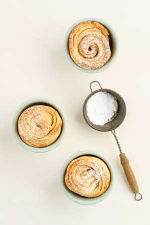 Fresh baked cruffins trend pastry in light bowlsの写真素材