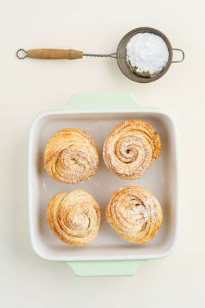 Fresh baked cruffins trend pastry in light bowlの写真素材