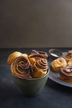 Fresh baked cruffins trend pastry on rustic platterの写真素材