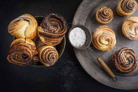 Fresh baked cruffins trend pastry on rustic platterの写真素材