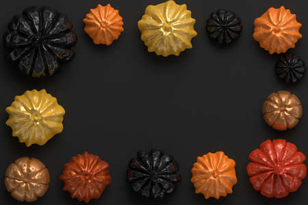 3d rendering of black, orange and gold shiny Halloween pumpkins with copyspace in the centerの写真素材