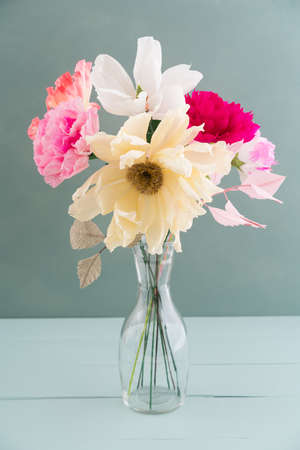 Crepe paper flower bouquet with peonies, camellia and poppies in a vaseの写真素材