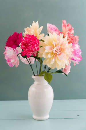 Crepe paper flower bouquet with peonies, dahlia and poppies in a vaseの写真素材