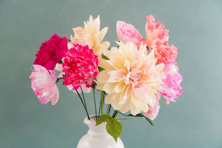 Crepe paper flower bouquet with peonies, dahlia and poppies in a vaseの写真素材