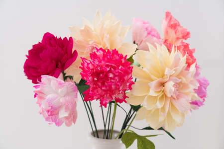 Crepe paper flower bouquet with peonies, dahlia and poppies in a vaseの写真素材