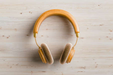 Wooden headphones on wooden background, 3D renderingの写真素材