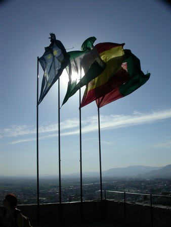 Backlit flags over the Alhambra in Granada, Spain