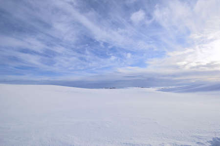 Snow Covers the Countryside Under a Partly Cloudy Sky on a Cold Winter Day on the Palouse of Washington State.の写真素材