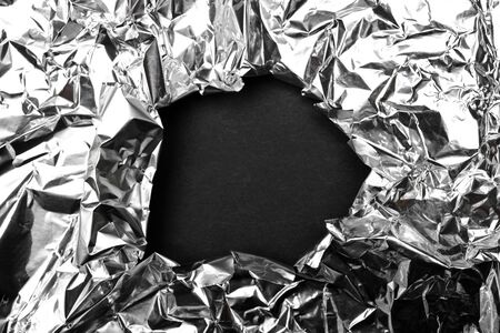 black hole on silver aluminiumの写真素材