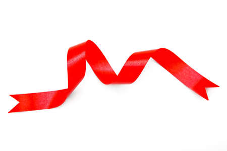 red and curly ribbon on white backgroundの写真素材