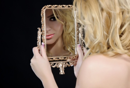 fashion woman on black background posingの写真素材