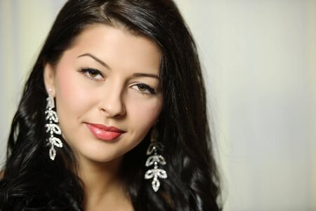 beautiful brown hair woman portrait indoorsの写真素材