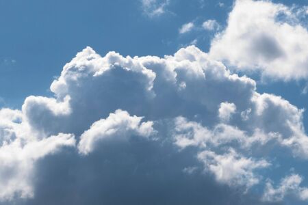beautiful white fluffy clouds in the blue sky