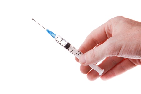 Hand with syringe isolated on white background.の写真素材