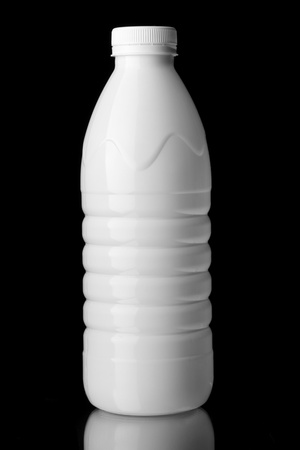 bottle of milk with a white cap isolatedの写真素材