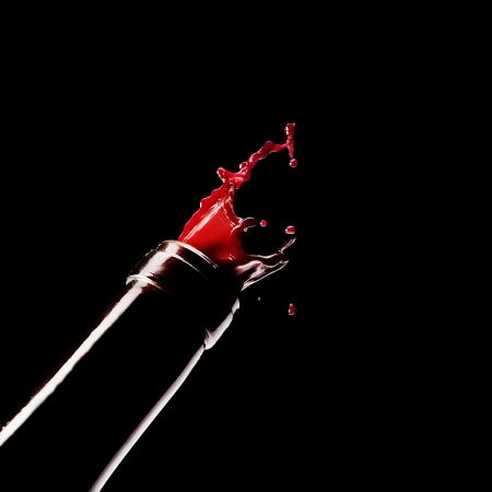 red wine comes out of the bottleの写真素材