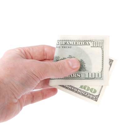A man's hand holding a one hundred dollar bill.の写真素材