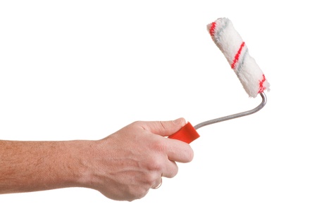 hand holding a painting brush isolated on withe background