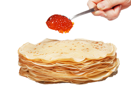 roasted pancakes with caviar in spoon on the white の写真素材