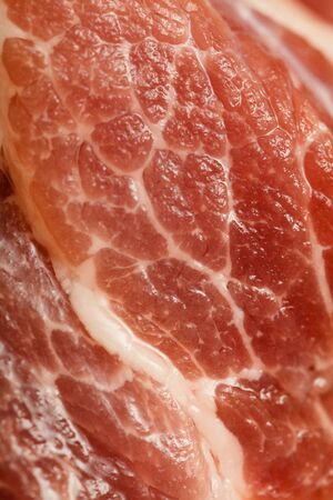 Piece of fresh red raw meat backgroundの写真素材