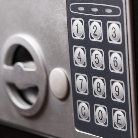 Electronic home safe keypad, Small home or hotel wall safe with keypad, closeup