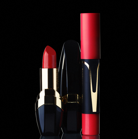 A red lipstick isolated on black backgroundの写真素材