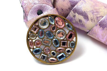Belt with buckle from varicolored stone on white background.の写真素材