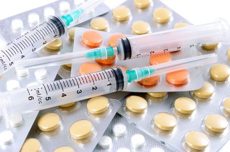 Syringes and tablets. Medical still life.