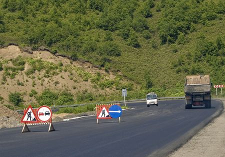 Traffic signs "Repair of the road" and "Passing prohibited»  の写真素材