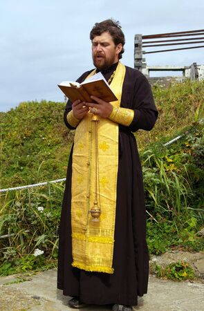 Orthodox priest reads prayer  の写真素材