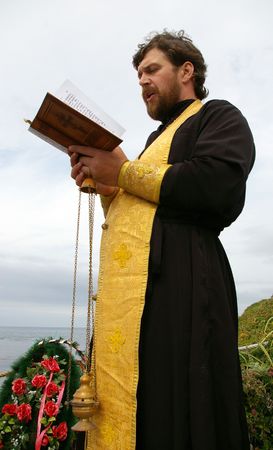 Orthodox priest reads prayer  
