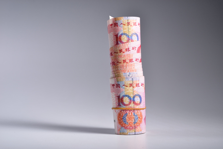 Roll of Chinese yuan on white backgroundの写真素材