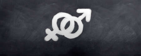 Male and female symbols Written in chalk on a blackboardのeditorial素材