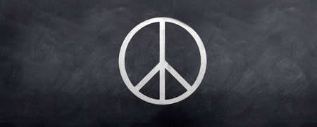 The Peace Symbol sketched on a blackboardの写真素材