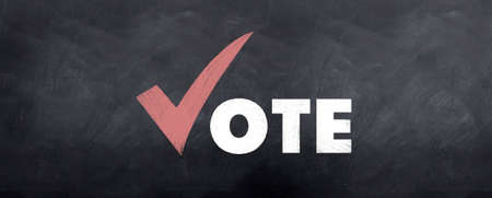A correct sign for voting sketched on a blackboardの写真素材