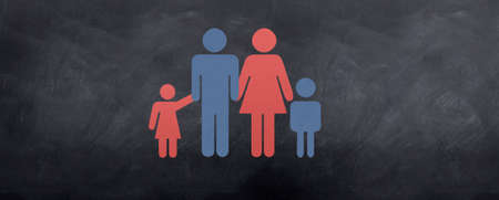 Family sign of mother, father, daughter and son on a chalkboard.の写真素材